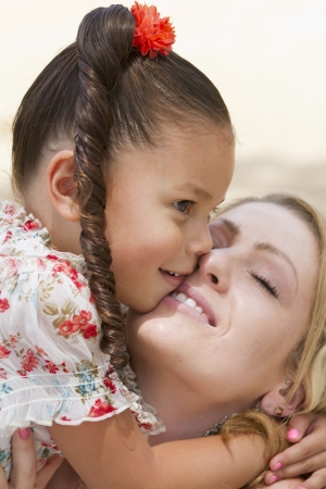 A young girl enjoys the afternoon with her family.の写真素材