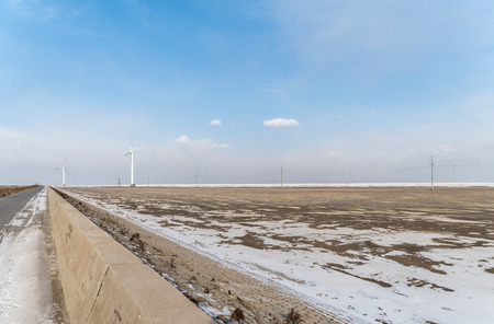 Wind turbines at the side of a road