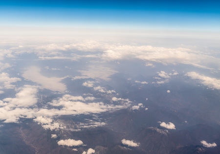 Aerial view of clouds above landの写真素材