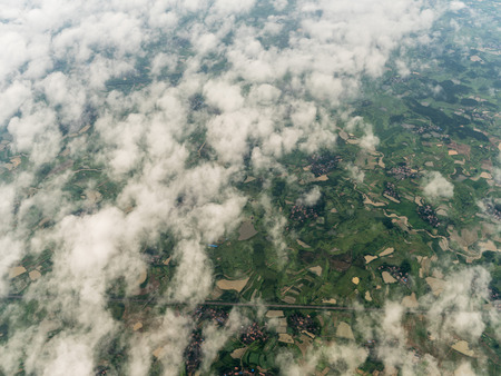 High angle view of farmland and buildingsの写真素材