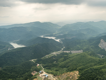Farmland and village on a mountainの写真素材