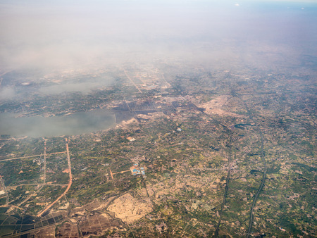 Aerial view of farmland and buildingsの写真素材