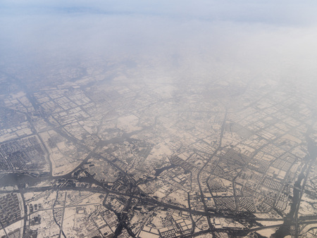 High angle view of foggy farmland and riverの写真素材
