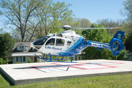 HOT SPIRNGS, VIRGINIA- MAY 3 2017: Patient is transported via air ambulance to a trauma center after a fall.のeditorial素材