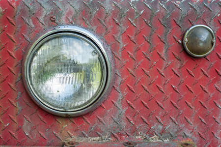 Headlights on rusted and weathered diamond plate sheet metalの写真素材