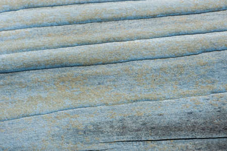Aged, weathered and peeling paint surface background.