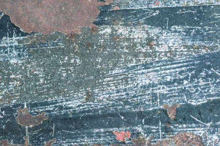 Aged, weathered and peeling paint surface background.の写真素材