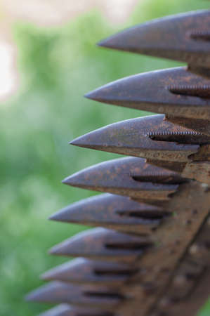 Close up photograph of a rusty plow