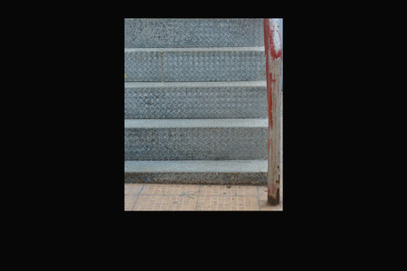 A stairs to the basement of the house, black background, isolated.の写真素材