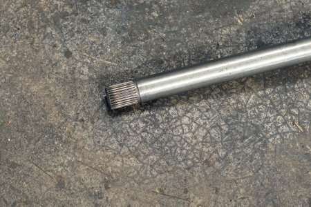 A close up shot of a metal pipe on a rustic backgroundの写真素材
