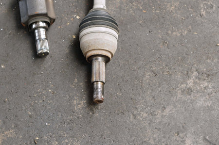 A Spark plug metal gear on the floor, closeup of car.の写真素材