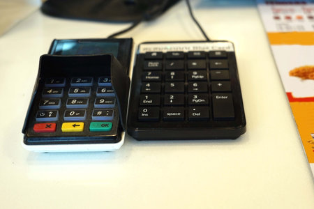 A payment point with credit card reader and keypad for service a customers.の写真素材