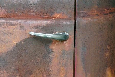 A old door handle of the rusty classic car, classic stlye concept.の写真素材