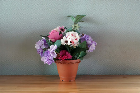 A flowers in a vase on a wooden table in the cafe, decoration concept.の写真素材