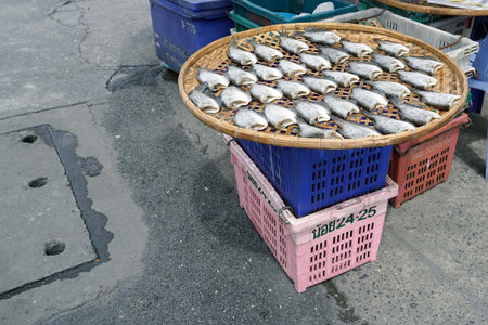 A dried fish in a basket at beside the street near the bazaar market.