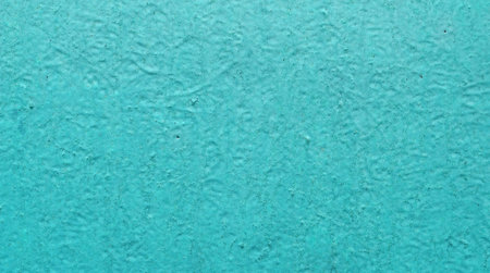A old texture of old rustic wall covered with turquoise stucco, for texture and backgrounds design.の写真素材
