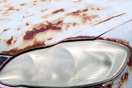 A vintage car headlight with a old body rusty car for texture and background, classic vintage...