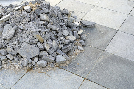 A construction scraps on the construction site in removing old tiles from the sidewalk.の写真素材
