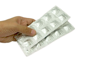 A pill pack in hand after examination from the doctor, Patient medical and health care concepts.の写真素材