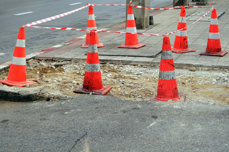 A lot of traffic cones protect beside a street in the constructions site, under construction.の写真素材