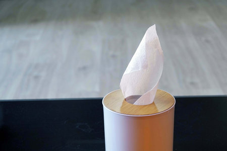 Crumpled tissue paper on a wooden stand.の写真素材