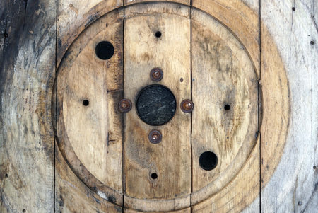 Old wooden rool with round hole for a fiber cable reelの写真素材
