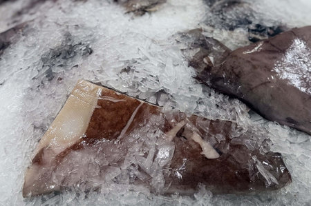 Fresh fish on ice in the market, closeup of photo.の写真素材