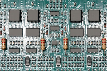 Close-up of a printed circuit board with many electronic components.の写真素材