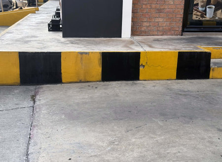 Empty car parking lot with yellow and black stripes.の写真素材