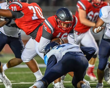 High School Football player in action during a game in South Texasのeditorial素材