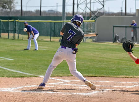 Young athletic boys making exciting plays during a baseball game