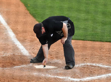 Action photo of high school baseball players making amazing plays during a baseball game