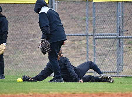Athletic girls in action playing in a softball gameの写真素材