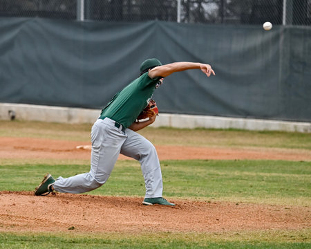 Action photo of high school baseball players making amazing plays during a baseball game