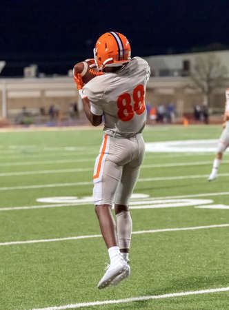 Great action photos of high school football players making amazing plays during a football game