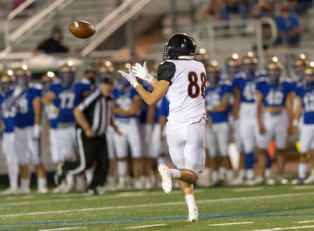 Great action photos of high school football players making amazing plays during a football gameの写真素材