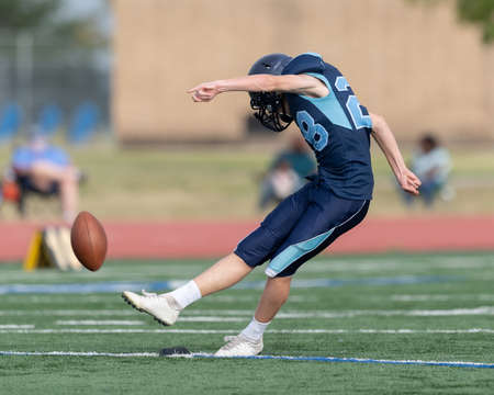 Great action photos of high school football players making amazing plays during a football gameの写真素材