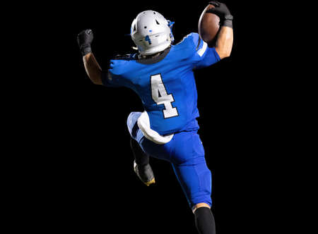 Great action photos of high school football players making amazing plays during a football gameの写真素材