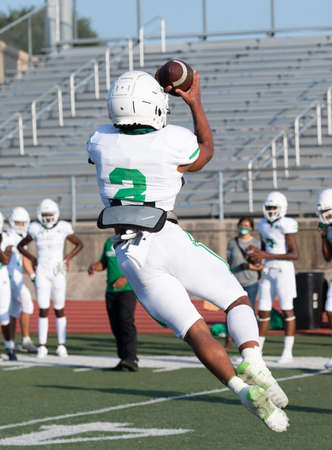 Great action photos of high school football players making amazing plays during a football game