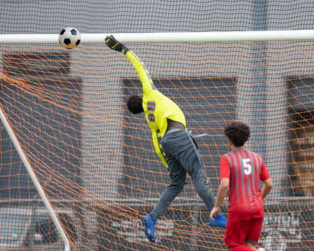 High school boys competing in a soccer match in south Texasの写真素材