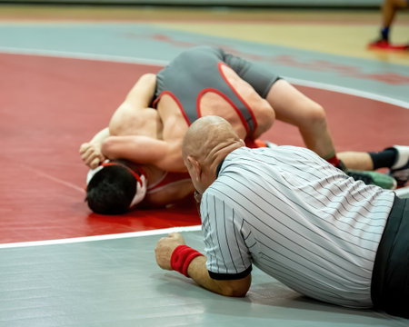 Boy wrestlers competing in a wrestling meetの写真素材