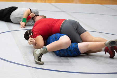 Boy wrestlers competing in a wrestling meetの写真素材