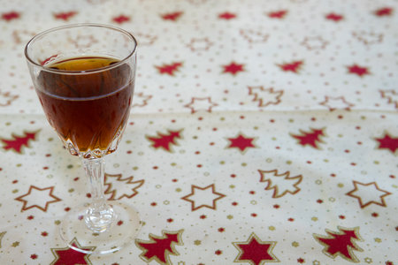 Aged port wine on a christmas table. It is a typical portuguese beverage. Copy space on the right.の写真素材