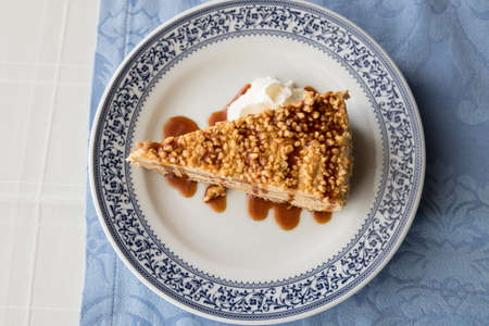 Delicious biscuit cake with crispy almonds on top ready to eat. Typical portuguese dessert.の写真素材