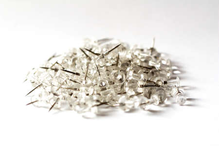 Silver office paper clips on white backgroundの写真素材