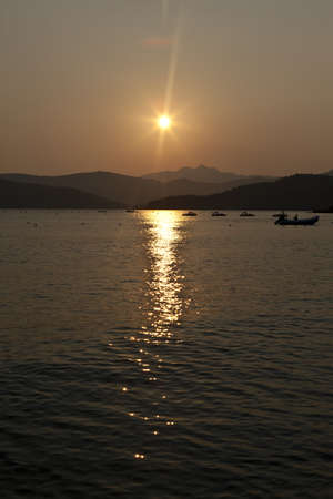 Sunset on beach on the island of Elba, Italyの写真素材
