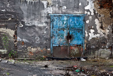 Door in industrial old abandoned factoryの写真素材