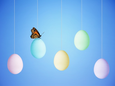Colorful Easter Eggs hanging from stringsの写真素材
