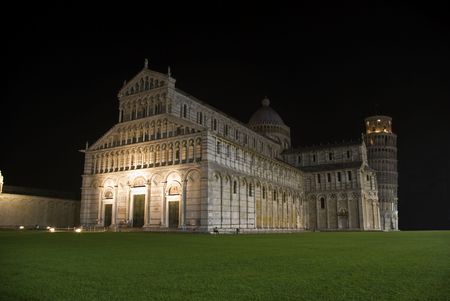 The battistero, the duomo cathedral and leaning tower of pisa in the field of miarcles.の写真素材