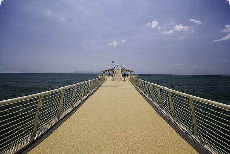 Umbrellas and seats populate the beautiful beach of viareggio beach in tuscanyの写真素材